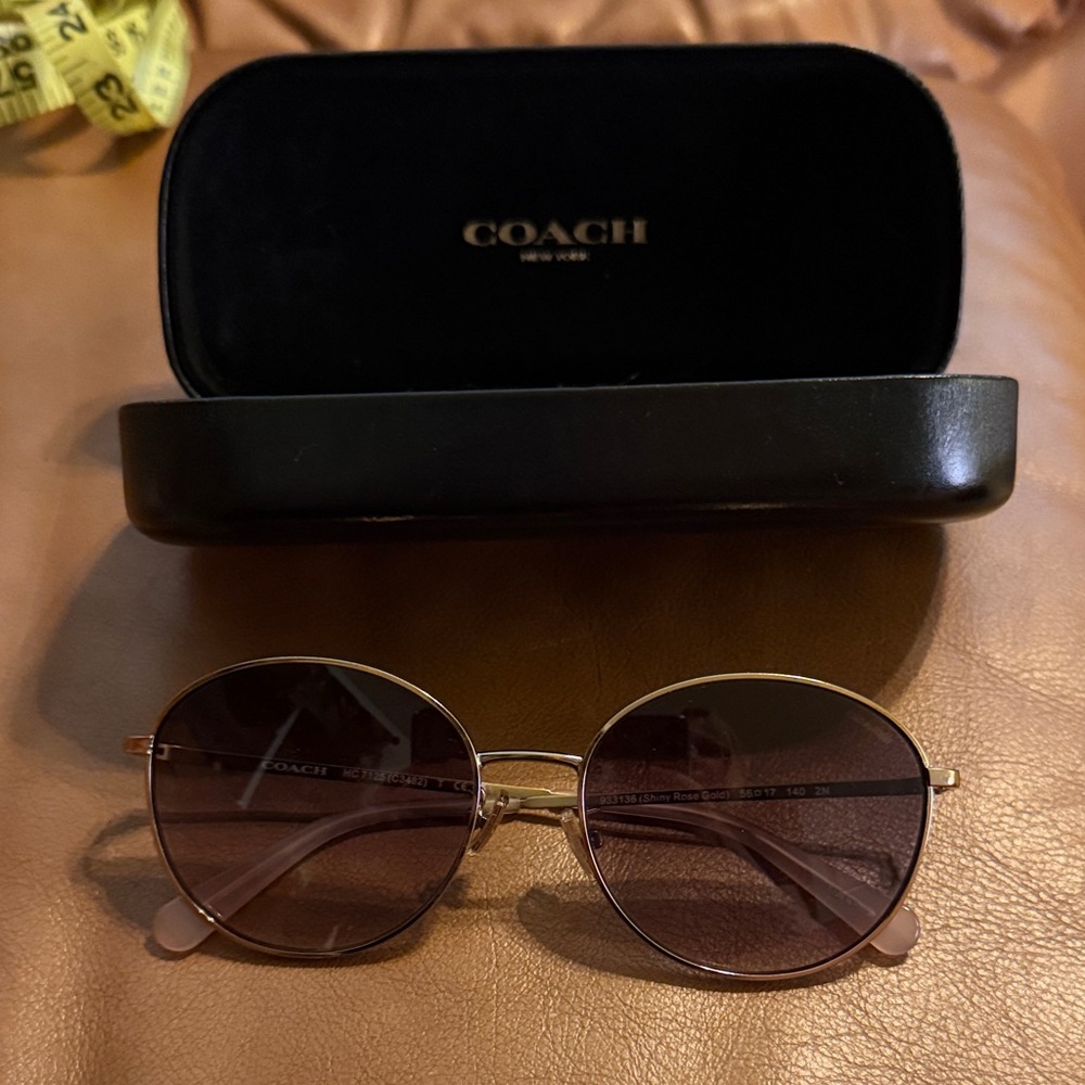 Coach Sunglasses with Gold Frame and Dark Lenses rose gold arms. Very good